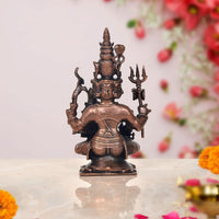 Copper Shiv Parivar showpiece: seated bronze deity with tall headpiece and tridents