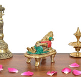Brass Ganesha statue, front angled view; red torso and green skirt accents