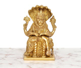 Brass Narasimha statue front view, lion-faced deity seated with curved claws