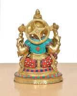 Brass Lord Ganesha idol back/hood view with jeweled headgear and colorful blue-red clothing.