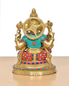 Brass Lord Ganesha idol back/hood view with jeweled headgear and colorful blue-red clothing.
