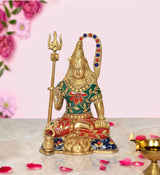 Brass Lord Shiva statue, seated with trident, green-and-red torso, 7 inch