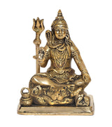 Brass Shiva murti statue seated, trident raised, detailed face and layered jewelry