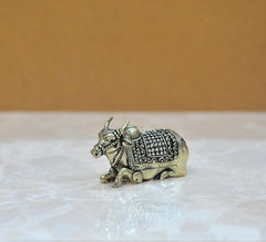 Brass Nandi bull figurine with decorative saddle patterns, side profile