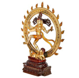 Shiva Nataraj brass idol side view with raised arms, dancing stance and ornate halo