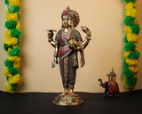 Dhanvantari brass figurine with detailed crown and red-green beaded stonework