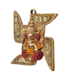 Brass Ganesha swastik wall hanging, side view with red bead clusters and gold dots