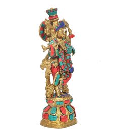 Krishna statue, multicolor armor plates and circular halo, profile stance on base