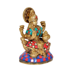 Lakshmi brass figurine, raised arms with teal and red jeweled details on base