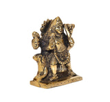 Brass Kal Bhairava idol angled view, detailed face and ornaments on pedestal base