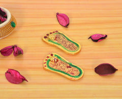 Two Lakshmi charan paduka footprints, multicolor gold motif and decorative borders
