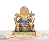 Back view of seated Lord Ganesha brass idol with multicolor belt and ornaments