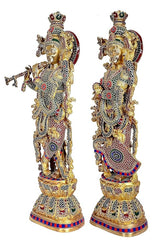 Brass Radha Krishna statue angled view, Krishna holding a flute, detailed ornaments