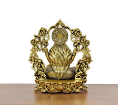 Lakshmi Maa brass idol back view, floral arch frame and patterned base