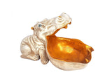 Resin hippo face wine holder, side view with shiny orange-gold inner bowl