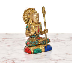Brass Shiva figurine side angle, multicolor gemstone border and trident