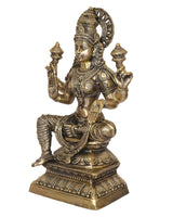 Lakshmi goddess statue, side view with raised hands and engraved ornaments, brass tone