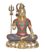 Brass Shiva idol seated pose, trident in left hand, jeweled stonework