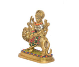 Side view: Durga Maa seated on lion statue with multicolour beaded detailing on dress