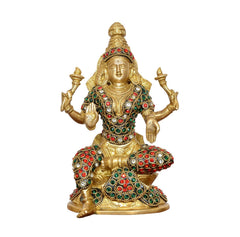 Brass Lakshmi goddess idol, front view seated on gold base with red and green gemstone accents