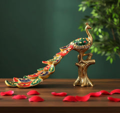 Multicolor brass peacock figurine perched on a small stand, 8-inch height