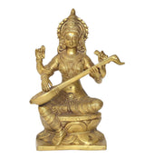 Brass Saraswati statue front view, seated with veena, raised hands and detailed ornaments