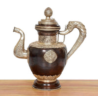 Dark brown brass teapot with engraved body, chain handle detail, and rounded spout