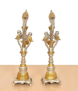 Back view of brass parrot diya oil lamp stands, set of 2, detailed wings and bases