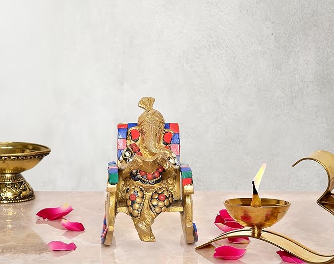 Brass Ganesha statue on chair, reading, colorful accents, 5 inch height