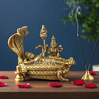 Golden brass Lakshmi Narayan idol reclining on Anantha shayana serpent bed, 12.8 cm