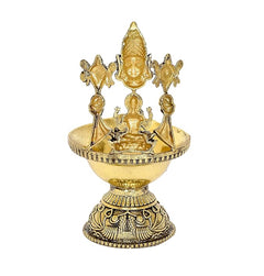Brass oil lamp diya with seated Lakshmi and fan-like attendant figures, round base