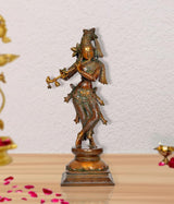 Standing brass Lord Krishna statue playing flute, colorful detailing on base
