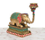 Brass elephant candle stand lamp, front view with striped base and ornate head bowl