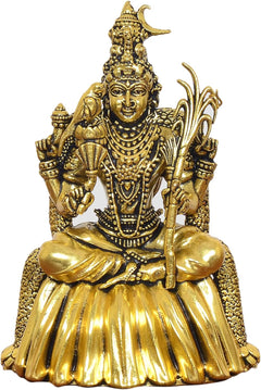 Close-up of golden brass goddess statue face, crown, and beaded ornaments