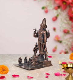 Copper Vishnu avatar idol from low angle, full figure with companion figures on base