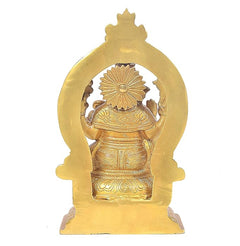 Brass Saraswati statue from behind with halo arch, detailed patterned robe