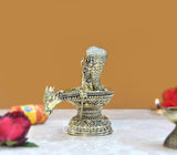 Brass Shivling idol on serpent stand with Nandi and trident, side angle