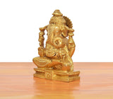 Ganesha idol angled view, brass golden figure seated on raised base