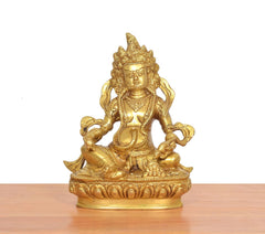 Golden Kuber Bhagwan brass murti, front view, seated with raised hands and crown