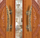 Brass door handle pair with Ganesha motif, curved lever and round backplates