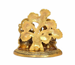Metal Lakshmi-Ganesha idol, ornate gold back silhouette on round base