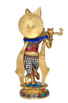 Back view brass Krishna idol with jeweled belt and patterned round base