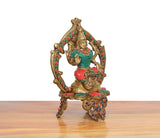 3/4 view Lakshmi brass idol, teal top, red lower, multicolor beaded frame