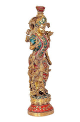 Brass Radha-Krishna idol figurine, three-quarter view with ornate crown and colorful garments