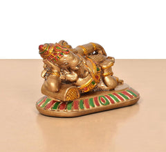 Resin Ganesha figurine angled view, decorated gold body and striped multicolor platform