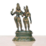 Brass Shiva and Parvati dancing figurines, detailed crowns and arms, round pedestal