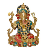 Brass Ganpati idol with teal headpiece, red ear ornaments, colorful jeweled detailing