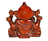 Back view of Ganesha idol seated on lotus, round carved halo, red-brown finish