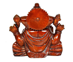 Back view of Ganesha idol seated on lotus, round carved halo, red-brown finish