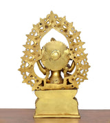Brass Saraswati idol back view, circular halo with sculpted figures and pedestal